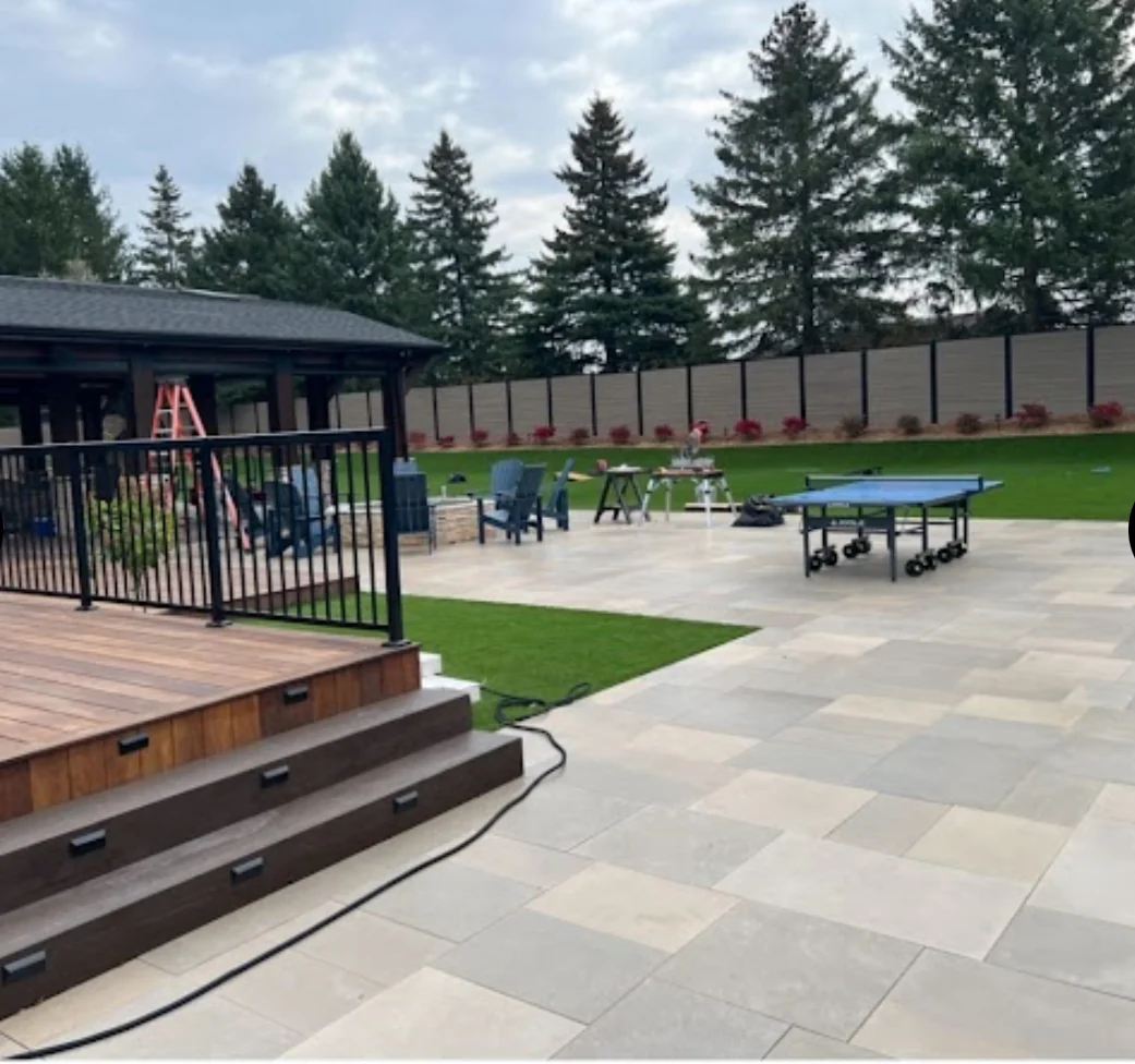 Interlock patio beside a deck at an NS Services project