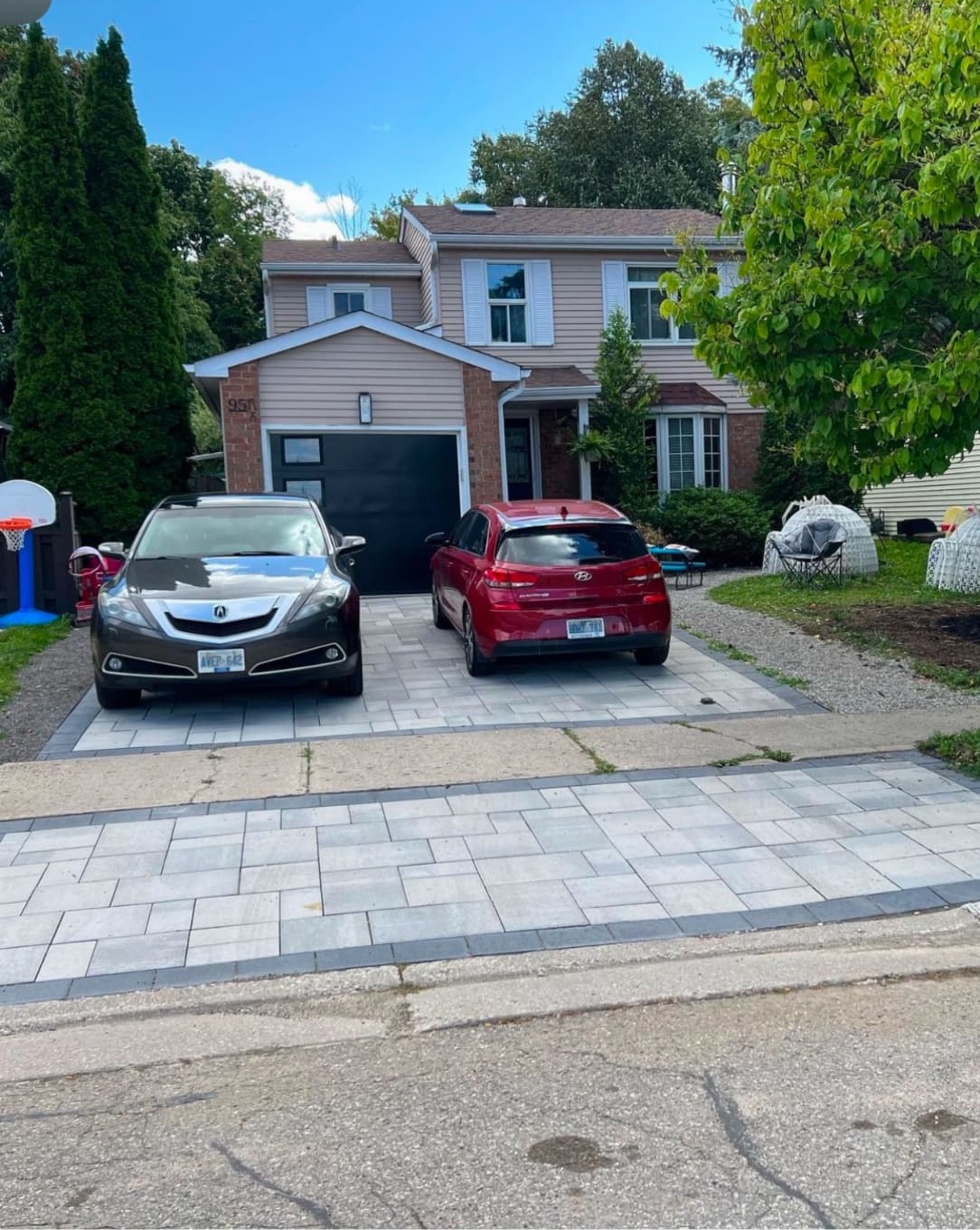 Interlocking paver border beside a driveway